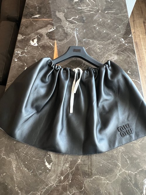 Miu Miu Classic Leather Skirt with Sweet and Cool Aesthetic, All-match and Stylish
