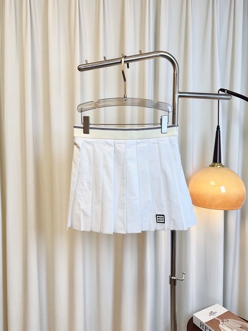 Miu Miu Customized Cotton Pleated Mini Skirt with Logo, Elegant and Versatile