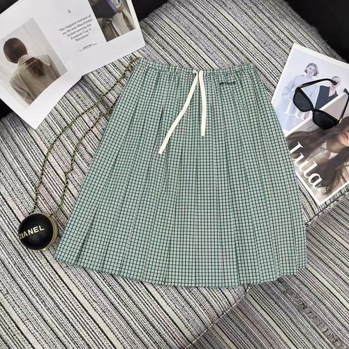 Miu Miu Checked Pleated Skirt with Embroidered Logo and Versatile Style