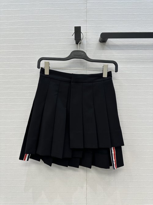The Row Exclusive Pleated Wool Skirt with Irregular Cut