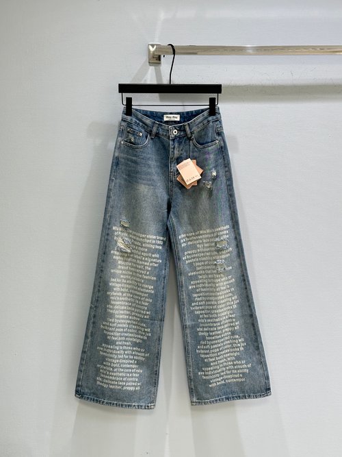 Miu Miu Distressed Denim Jeans with Irregular Holes, Vintage Print and Retro Vibe