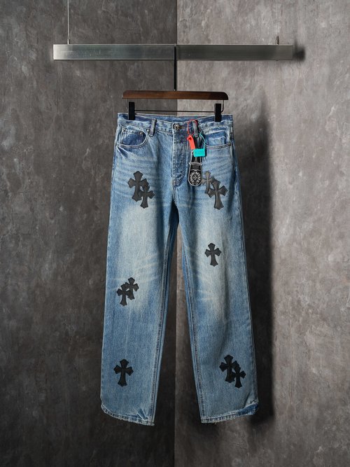 Chrome Hearts Distressed Jeans with Cross Emblem and Vintage Style